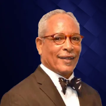 Portrait of Bruce N. Lewis smiling in business attire as a board member of the Black Chamber of Commerce of Palm Beach County.